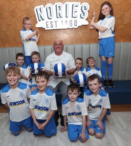 Nories supplies new shinty helmets for Rockfield youngsters